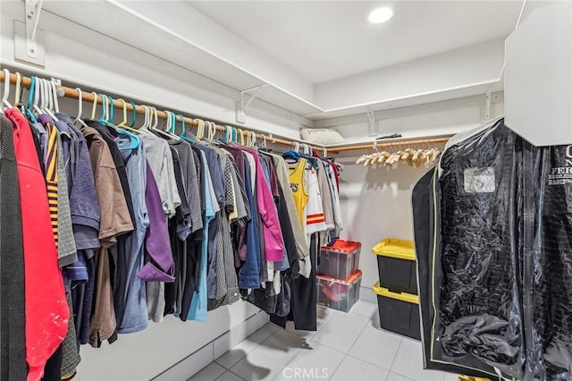 spacious closet with light tile patterned flooring