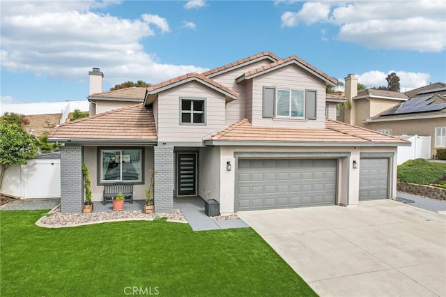 view of front of house with a garage and a front yard