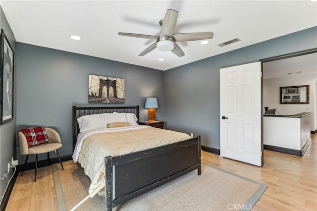 bedroom featuring light hardwood / wood-style floors and ceiling fan