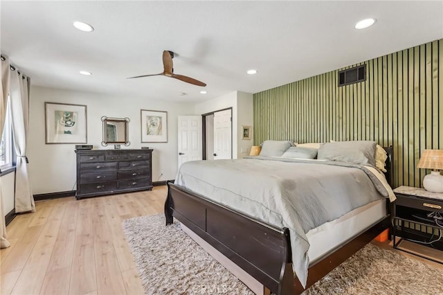 bedroom featuring ceiling fan and light hardwood / wood-style floors