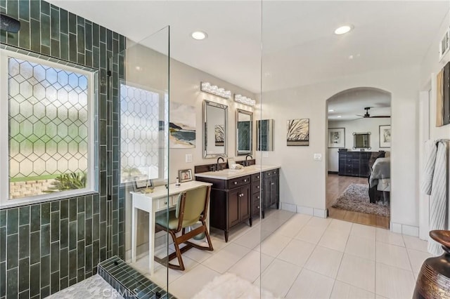 bathroom featuring tile patterned flooring, vanity, and ceiling fan