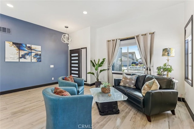 living room with light hardwood / wood-style floors