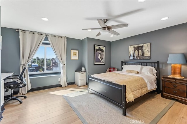 bedroom featuring ceiling fan and light wood-type flooring