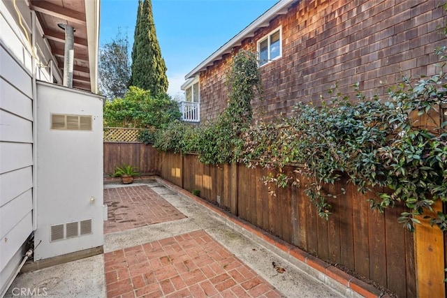 view of patio featuring fence