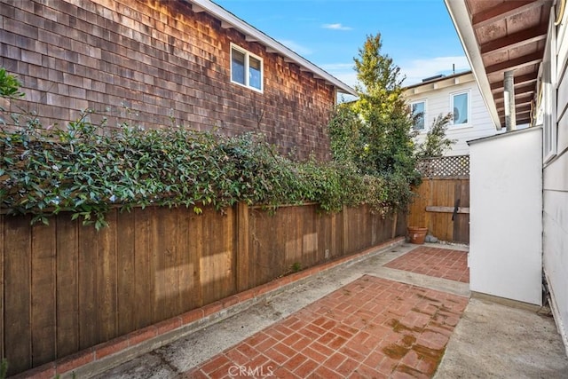 view of patio / terrace featuring fence