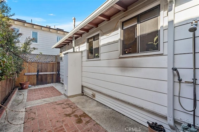 view of patio featuring fence