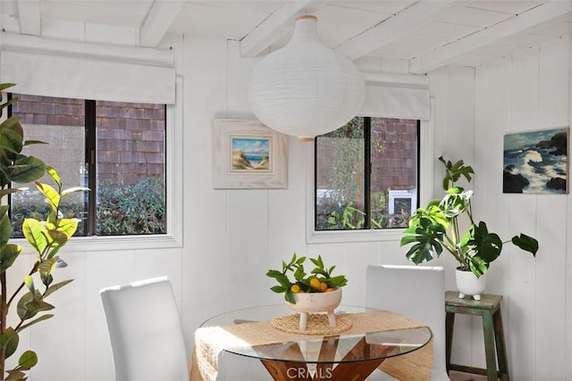 dining room featuring beamed ceiling