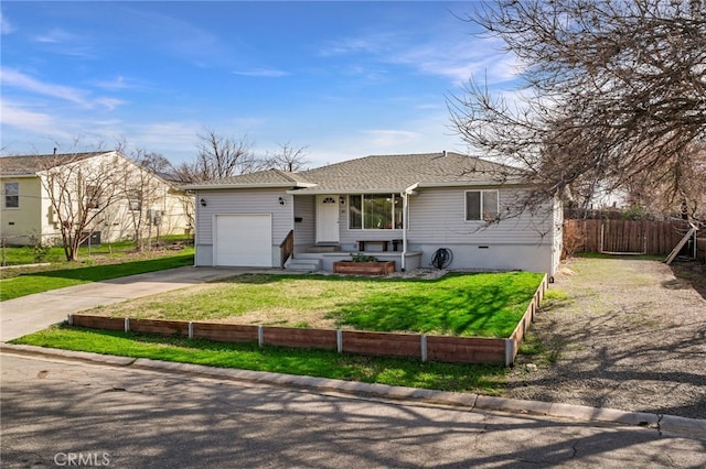 ranch-style house featuring a garage and a front yard