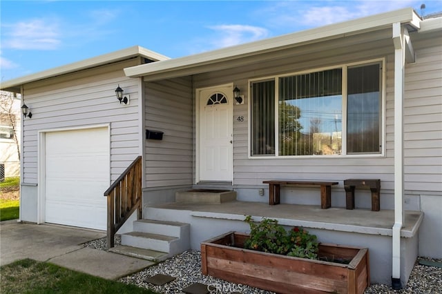 view of exterior entry with a garage