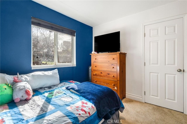 bedroom featuring light colored carpet