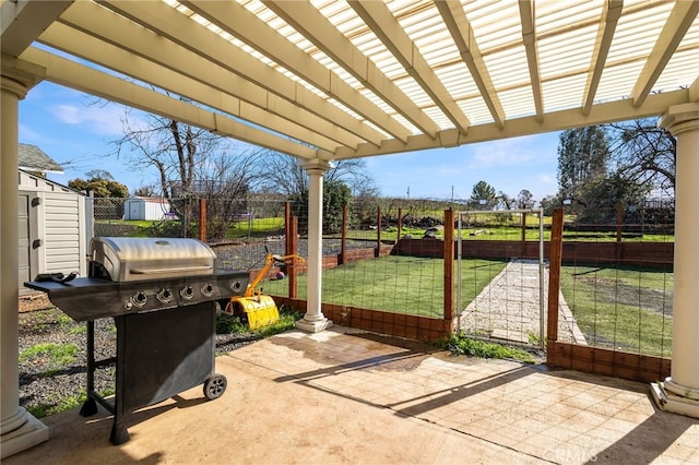 view of patio / terrace featuring area for grilling, a pergola, fence, and a gate