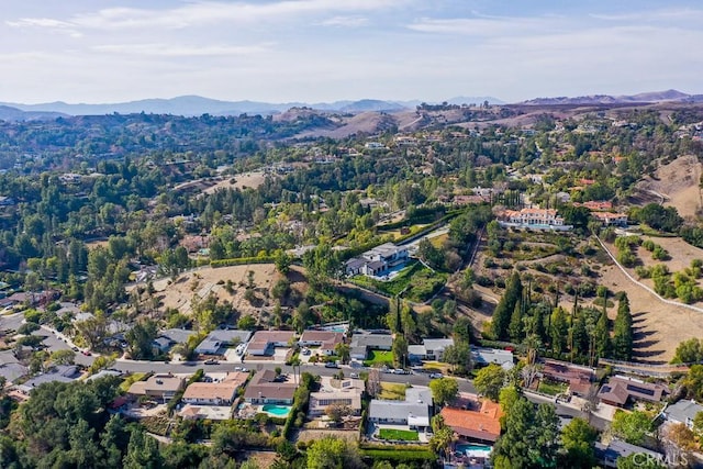 birds eye view of property with a residential view and a mountain view