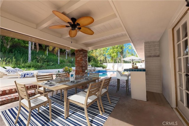 view of patio with a ceiling fan, outdoor dining area, fence, and a fenced in pool