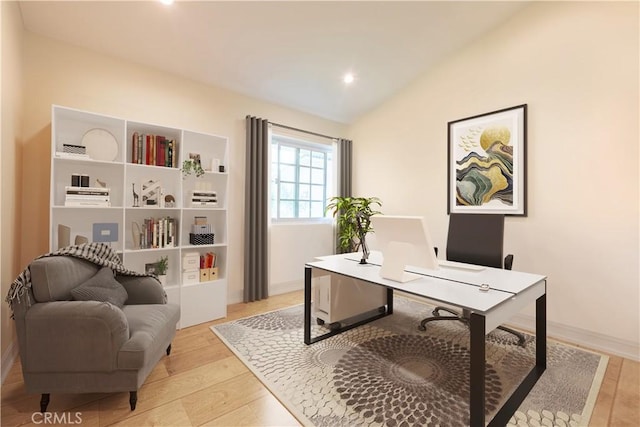 office featuring light wood finished floors, baseboards, and vaulted ceiling