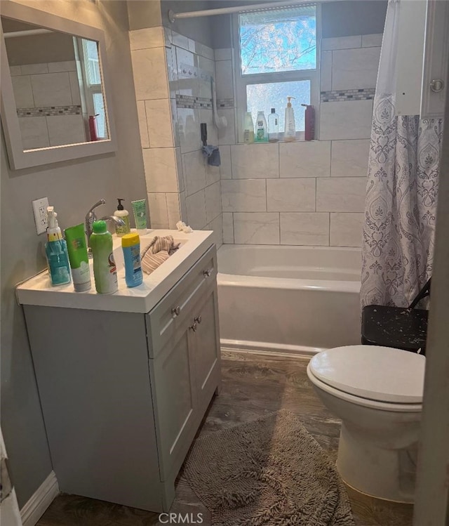 full bathroom with shower / bath combo, vanity, and toilet