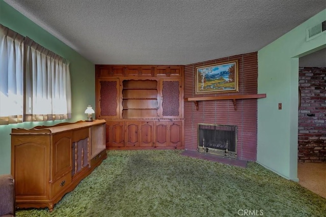 unfurnished living room with a fireplace, light carpet, and a textured ceiling