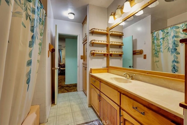 bathroom featuring vanity and shower / bathtub combination with curtain