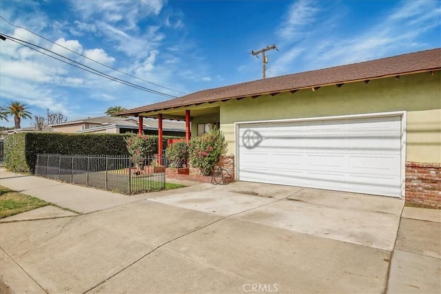 ranch-style house featuring a garage