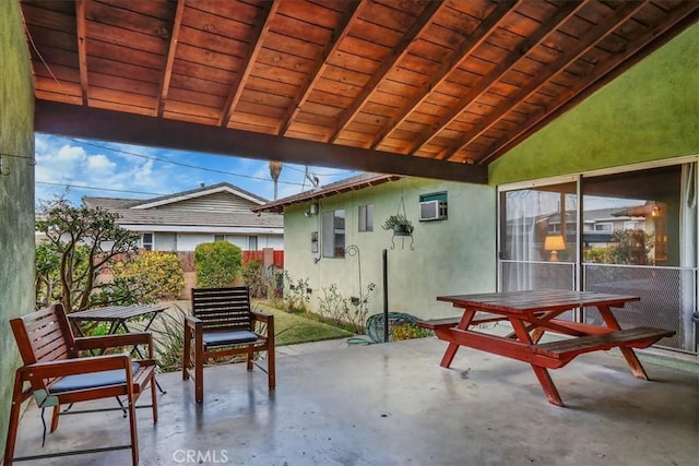 view of patio / terrace with a wall mounted AC