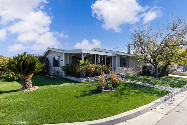 ranch-style house with a front yard