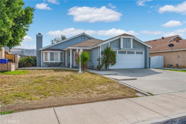 single story home featuring a garage and a front yard