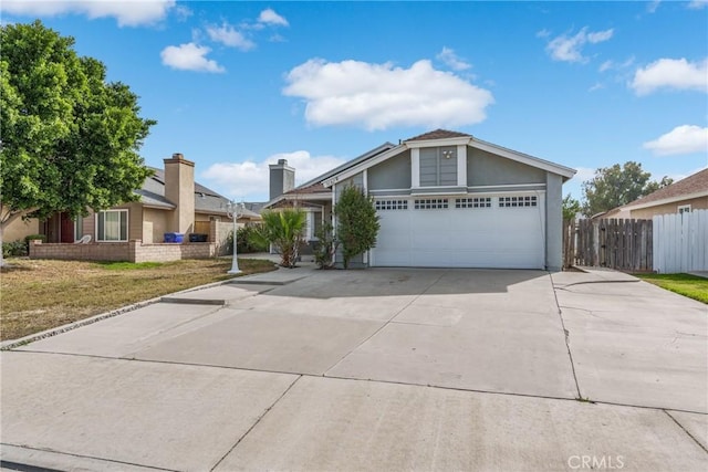 view of front of home with a garage and a front yard