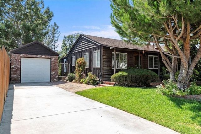 26357 Hillcrest Ave, Lomita, CA 90717 - ranch-style house with concrete driveway, an outbuilding, a front lawn, and a detached garage