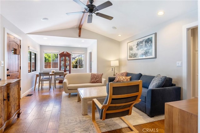 living room with light wood-style floors, recessed lighting, visible vents, and lofted ceiling with beams