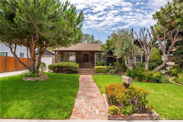 view of front of home featuring a garage and a front lawn