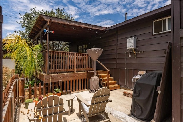 view of patio / terrace with area for grilling, stairway, and a wooden deck