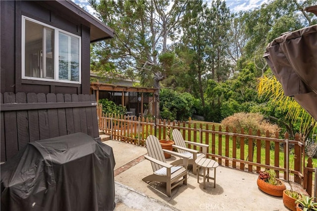 view of patio / terrace with fence and grilling area