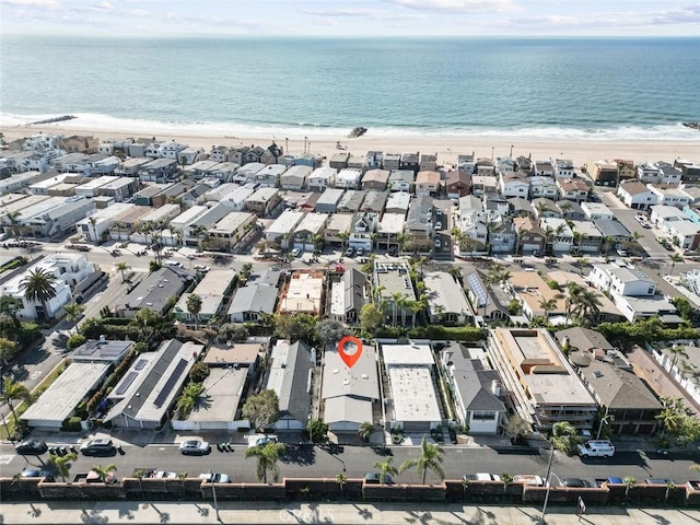 drone / aerial view with a water view and a view of the beach