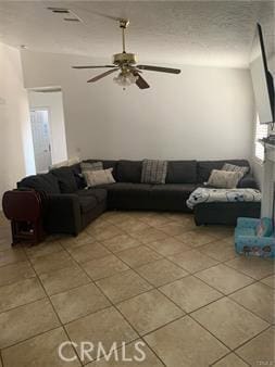 tiled living room with ceiling fan