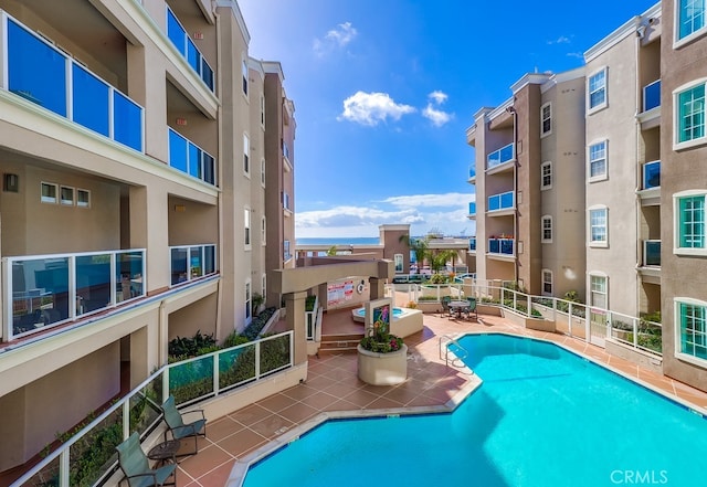 view of swimming pool with a patio