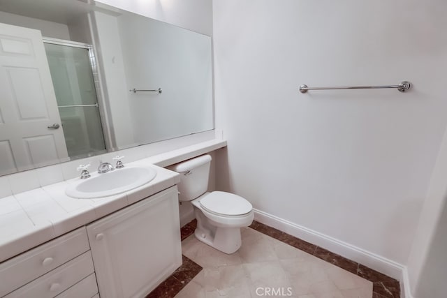 bathroom featuring an enclosed shower, vanity, and toilet