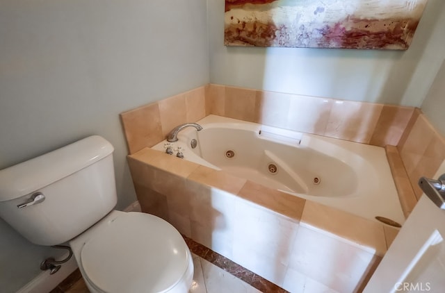 bathroom with tiled bath and toilet