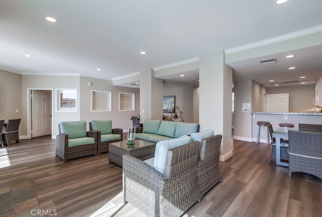 living room featuring crown molding and hardwood / wood-style floors