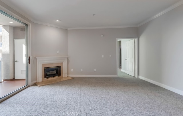 unfurnished living room with ornamental molding and light colored carpet