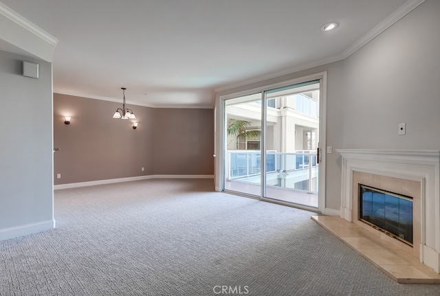 unfurnished living room featuring crown molding, a high end fireplace, light carpet, and a notable chandelier