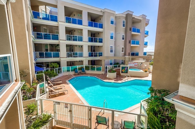 view of swimming pool featuring a patio