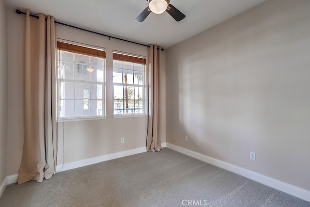 unfurnished room featuring light carpet and ceiling fan