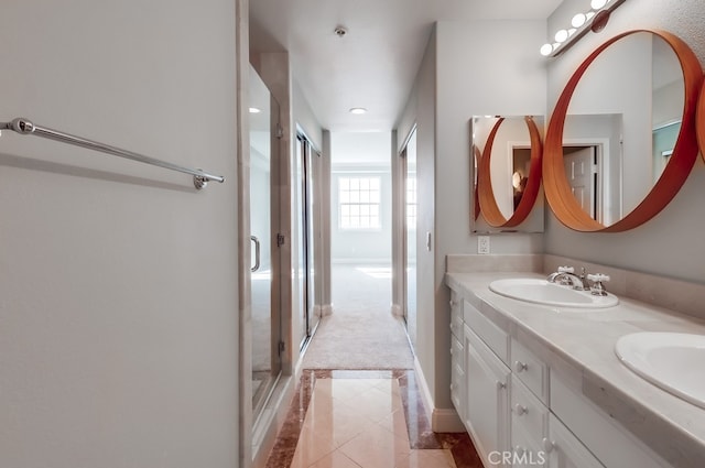 bathroom featuring vanity, tile patterned floors, and a shower with shower door