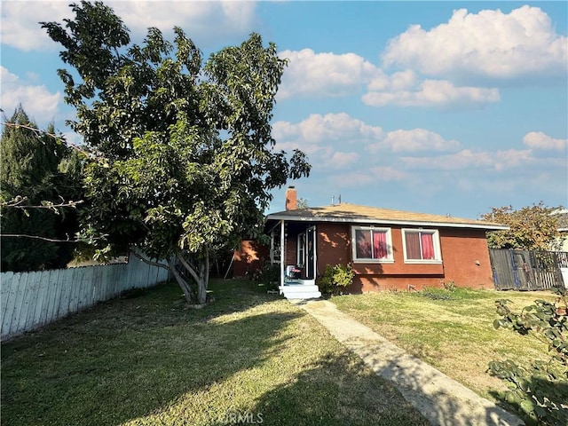 view of front of home with a front yard