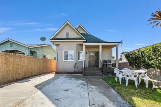 view of front of house with a porch and a patio area