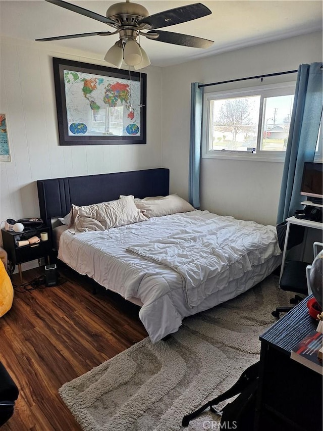 bedroom featuring ceiling fan and dark hardwood / wood-style flooring