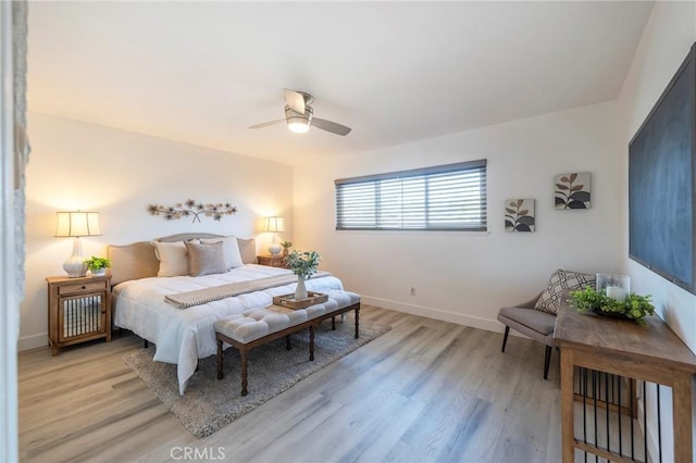 bedroom with ceiling fan and light wood-type flooring