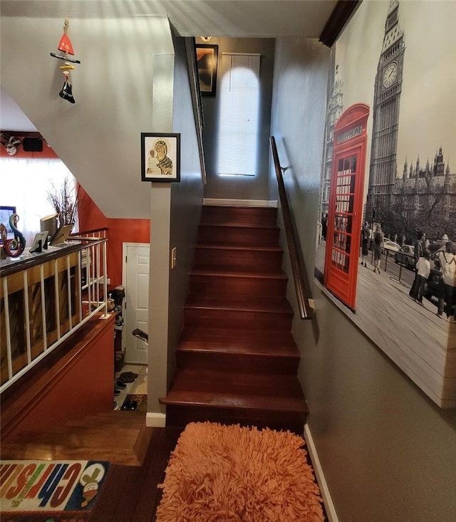 stairs with hardwood / wood-style floors