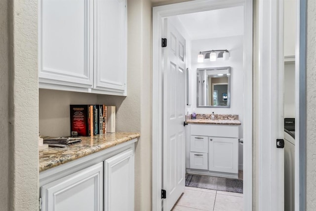 bathroom with vanity and tile patterned flooring