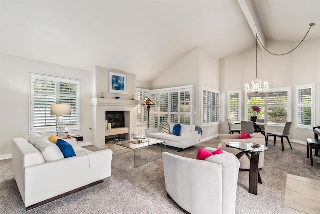 carpeted living room with high vaulted ceiling, a chandelier, and beam ceiling