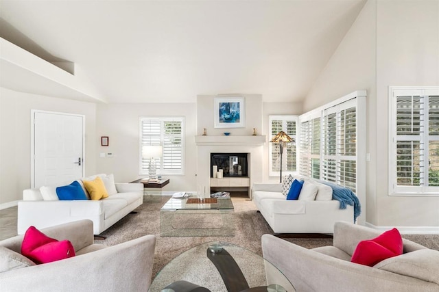 living room featuring lofted ceiling and a wealth of natural light